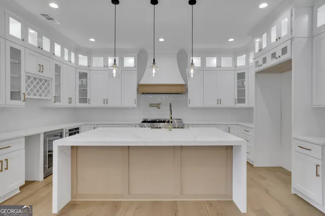 a view of an empty room with a staircase