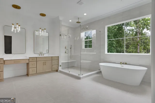 a bathroom with a tub sink and mirror