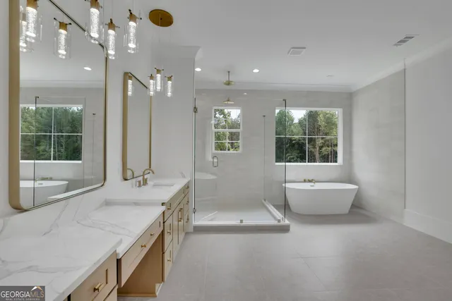 a view of a kitchen with a sink and wooden floor