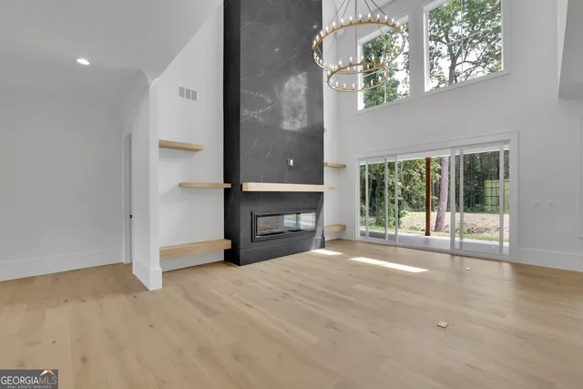 a view of a kitchen with a sink and a large window