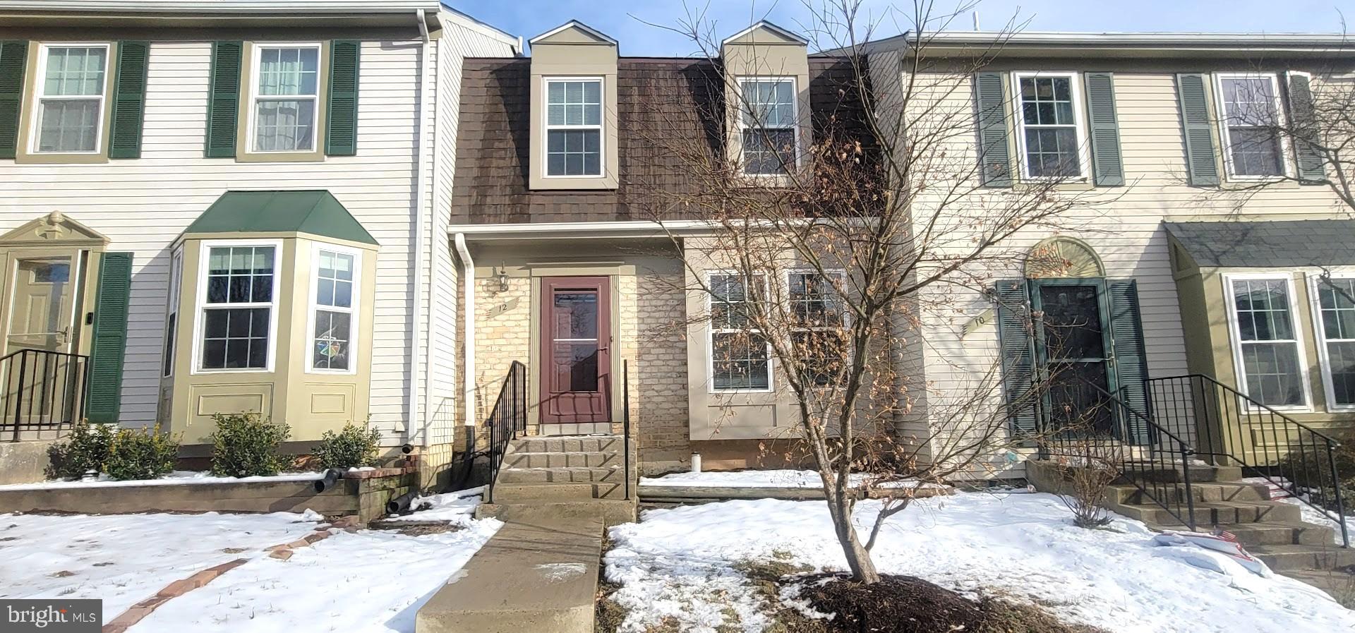 12 Sebastiani Boulevard Gaithersburg, MD 20878 - Photo 1 of 18 a front view of a house with a yard