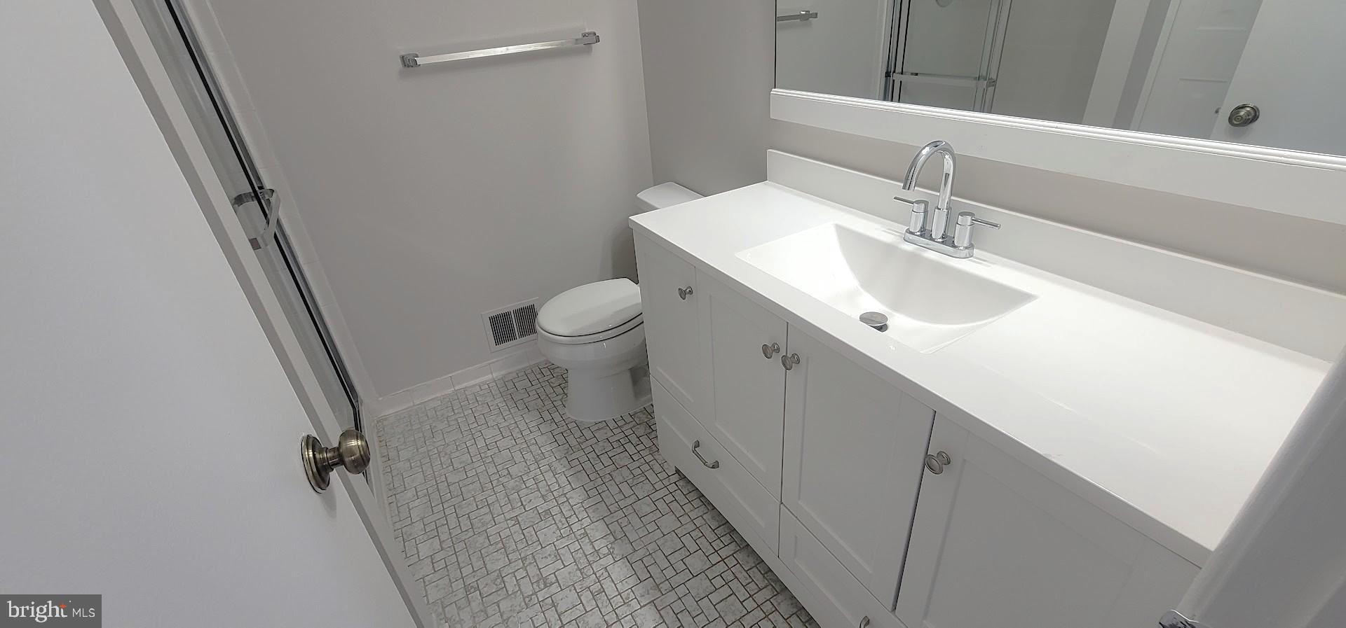 12 Sebastiani Boulevard Gaithersburg, MD 20878 - Photo 12 of 21 Sleek modern bathroom with elegant finishes.