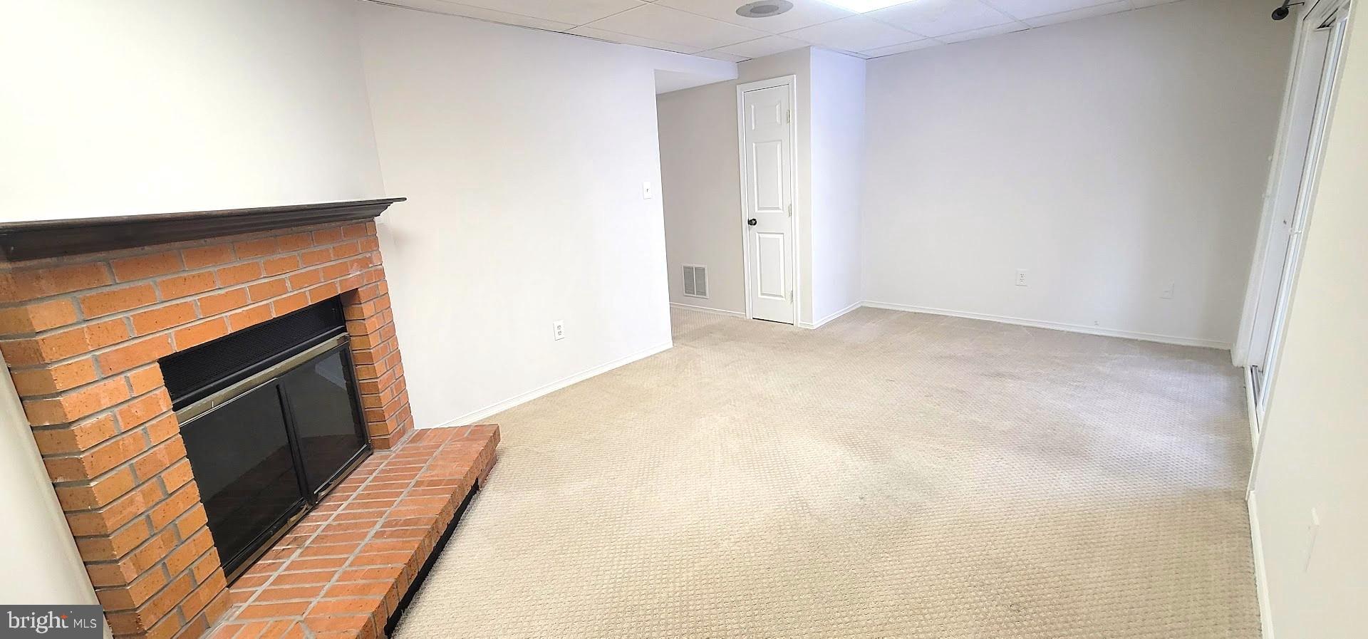 12 Sebastiani Boulevard Gaithersburg, MD 20878 - Photo 15 of 21 Cozy space with a charming brick fireplace.