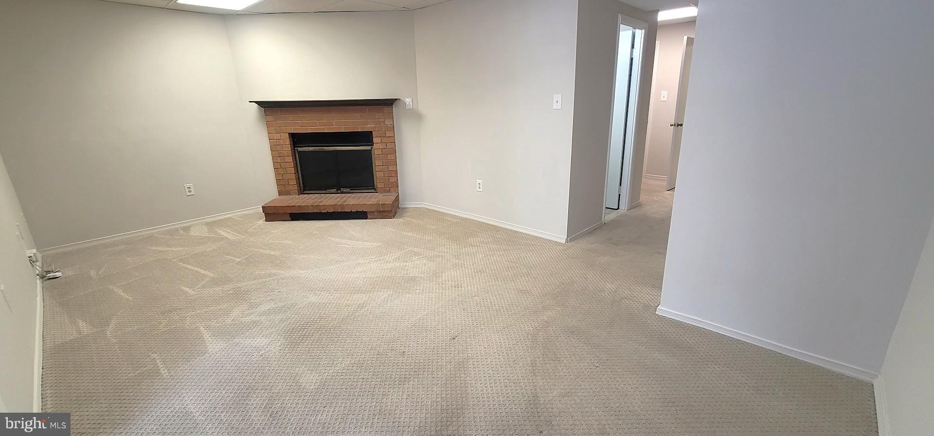 12 Sebastiani Boulevard Gaithersburg, MD 20878 - Photo 16 of 21 Spacious living area with cozy fireplace.