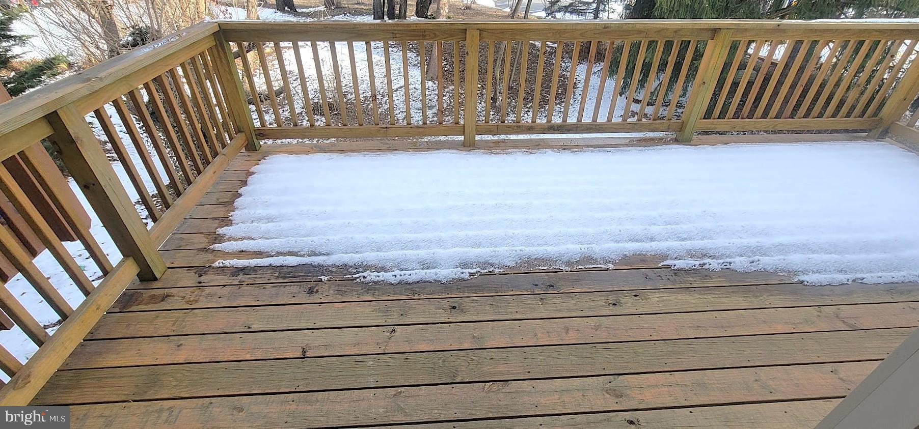 12 Sebastiani Boulevard Gaithersburg, MD 20878 - Photo 8 of 21 Snow-kissed deck awaiting spring's embrace.