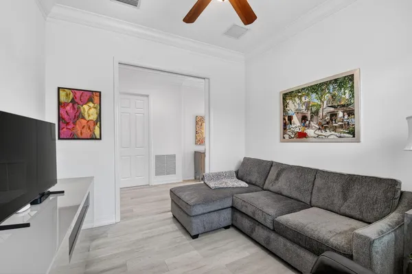 a bathroom with a sink vanity mirror and toilet