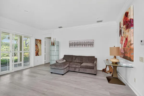 a kitchen with a refrigerator stove and cabinets