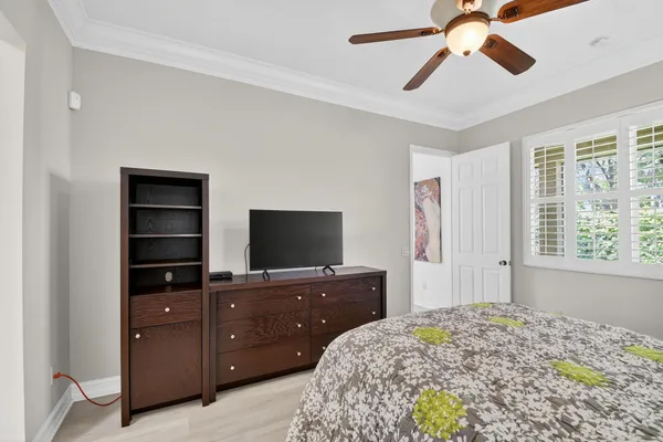 a view of a porch with furniture and floor to ceiling window