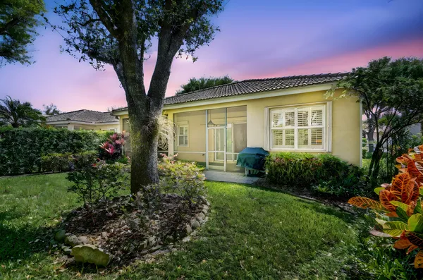 a living room with fireplace furniture and a large window