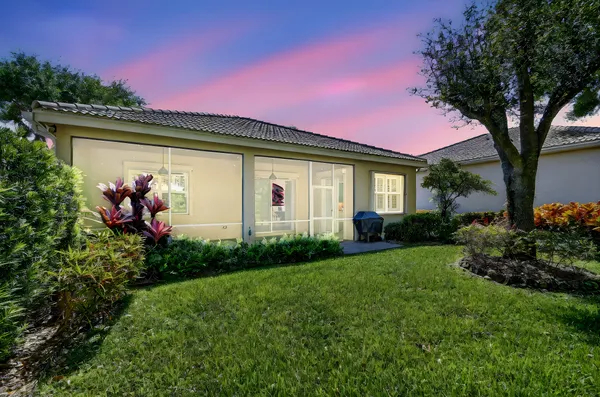 a living room with pool table and a flat screen tv