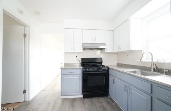 a kitchen with a stove and a sink