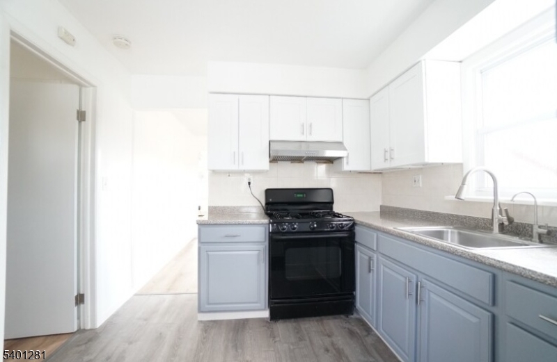 273 Hoover Avenue, Unit 2 Bloomfield, NJ 07003 - Photo 2 of 8 a kitchen with a stove and a sink