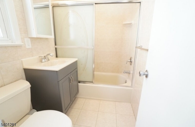 273 Hoover Avenue, Unit 2 Bloomfield, NJ 07003 - Photo 5 of 8 a bathroom with a sink toilet and shower