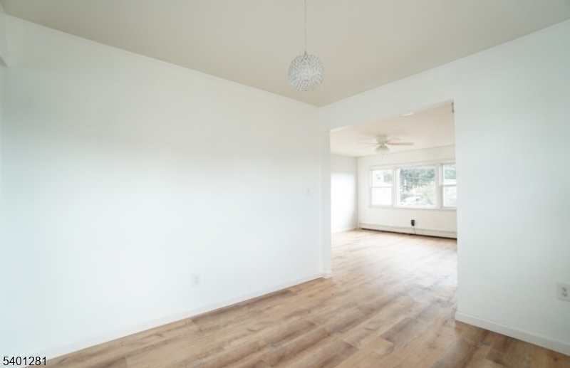 273 Hoover Avenue, Unit 2 Bloomfield, NJ 07003 - Photo 8 of 8 a view of a room with wooden floor and window