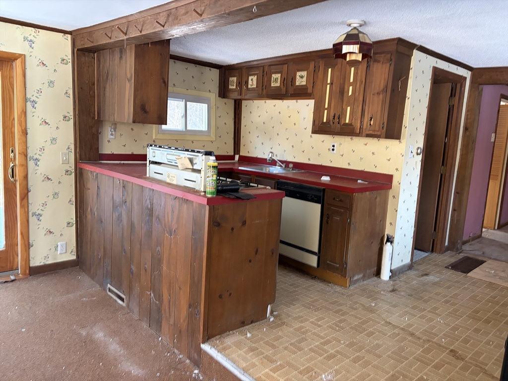 11 South Chesterfield Road Goshen, MA 01096 - Photo 6 of 30 a kitchen with a refrigerator and a sink