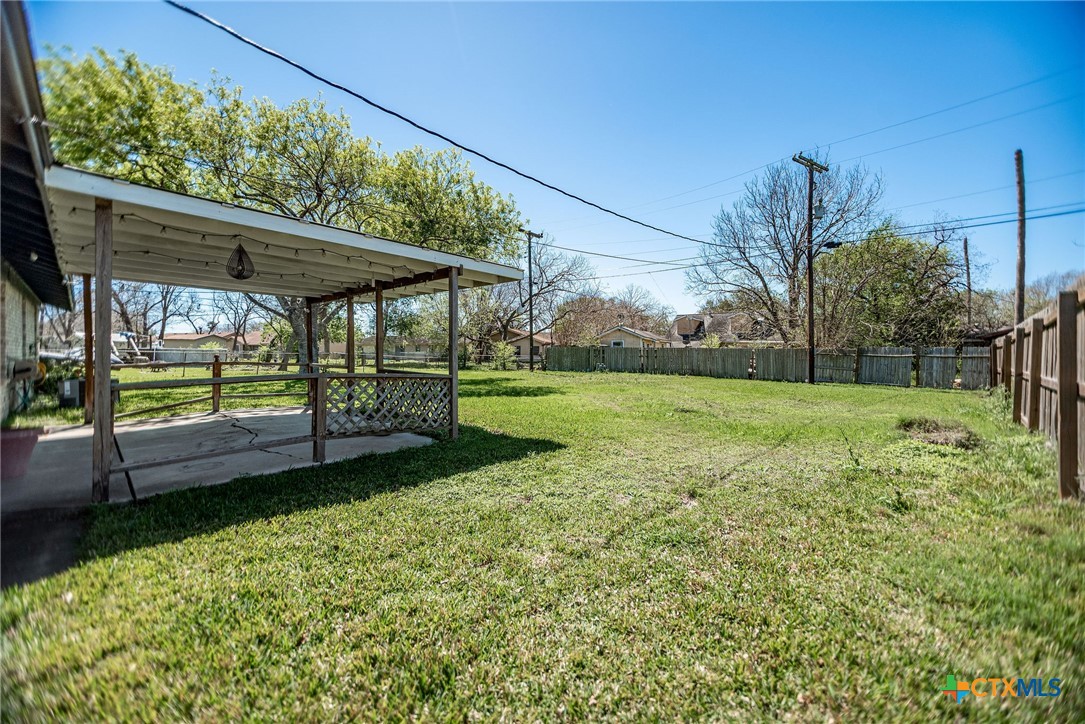 525 Travis Street Port Lavaca, TX 77979 - Photo 23 of 24 a view of a house with backyard and sitting area