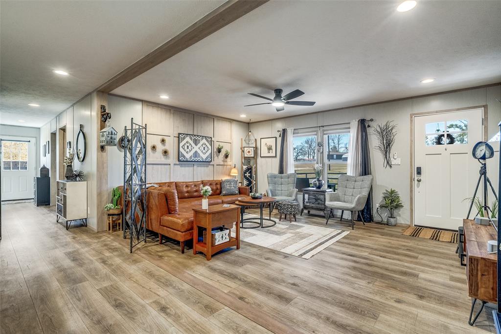 344 Hometown Way Springtown, TX 76082 - Photo 3 of 13 a living room with furniture and a flat screen tv