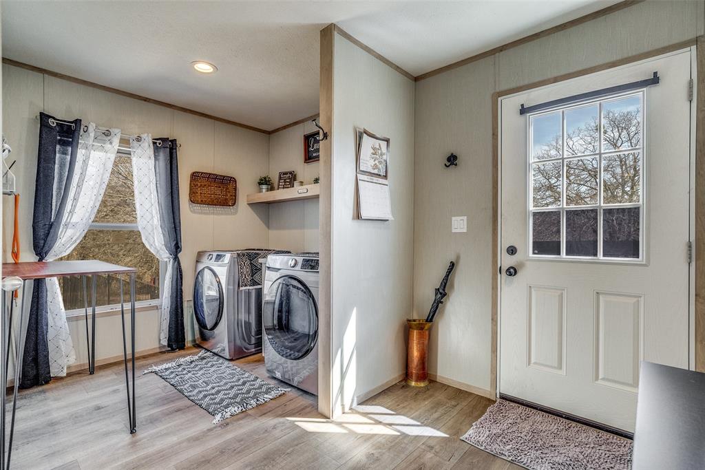 344 Hometown Way Springtown, TX 76082 - Photo 6 of 13 a storage room with washer and dryer