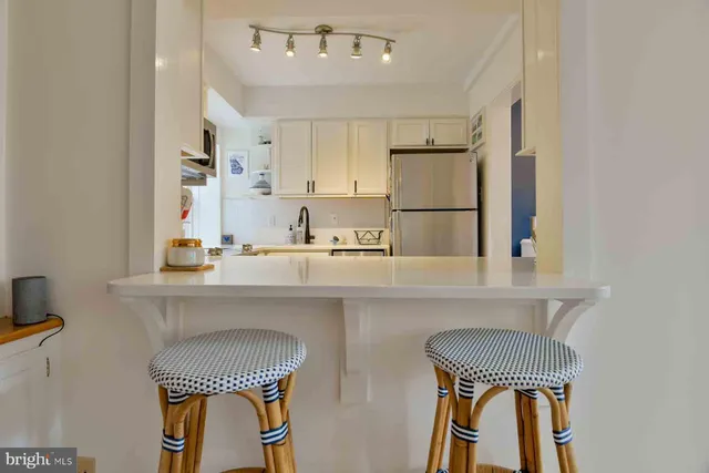 a kitchen with a sink cabinets and window