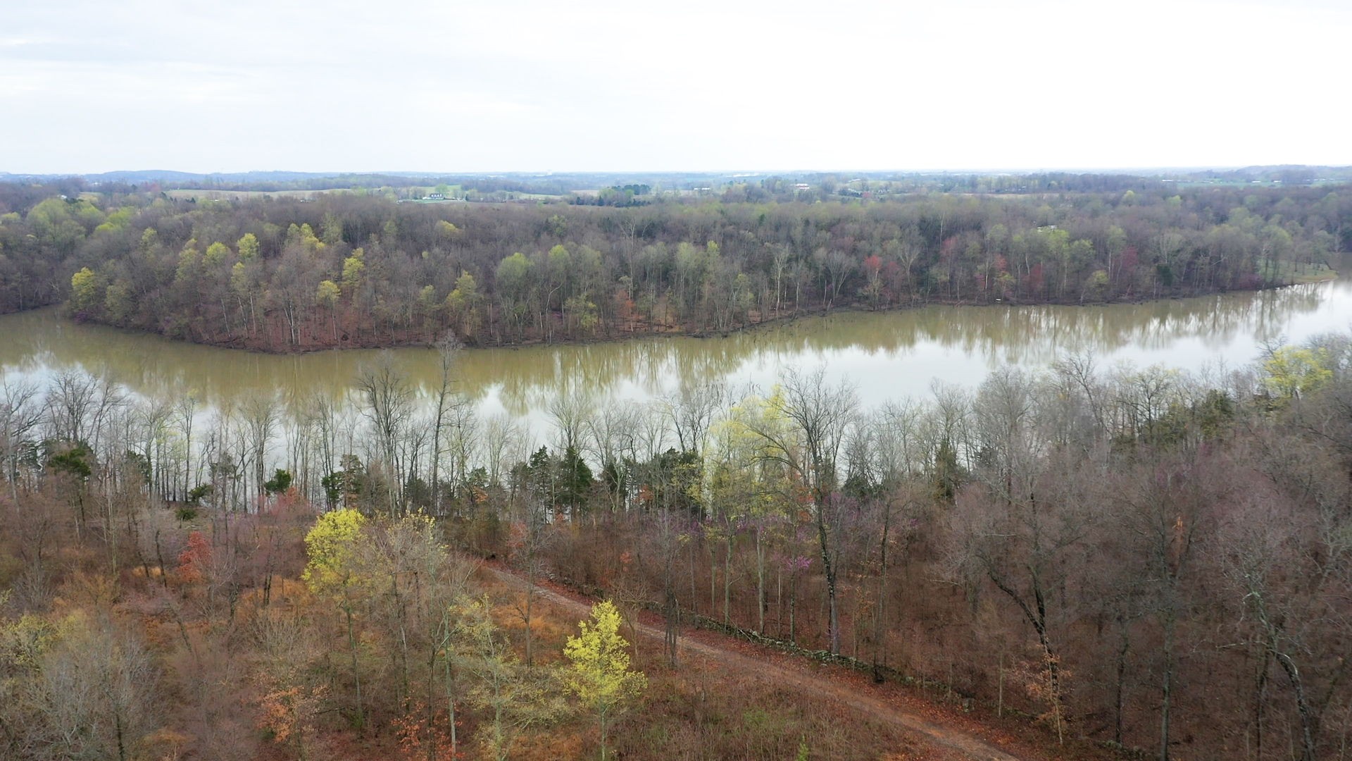 5273 Zander Road Hopkinsville, KY 42240 - Photo 3 of 75 a view of a lake with mountains in the background