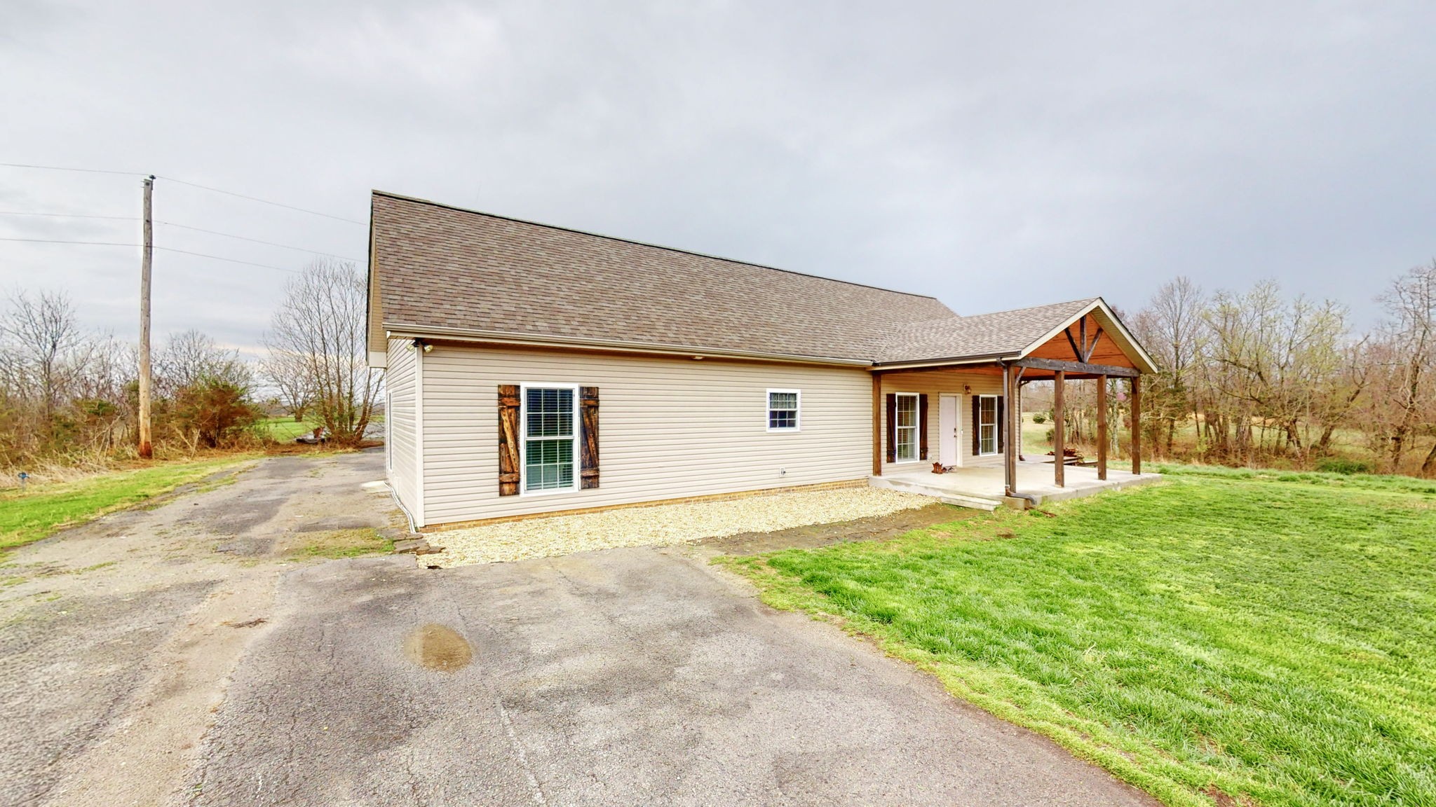 5273 Zander Road Hopkinsville, KY 42240 - Photo 35 of 75 a front view of house with yard and trees