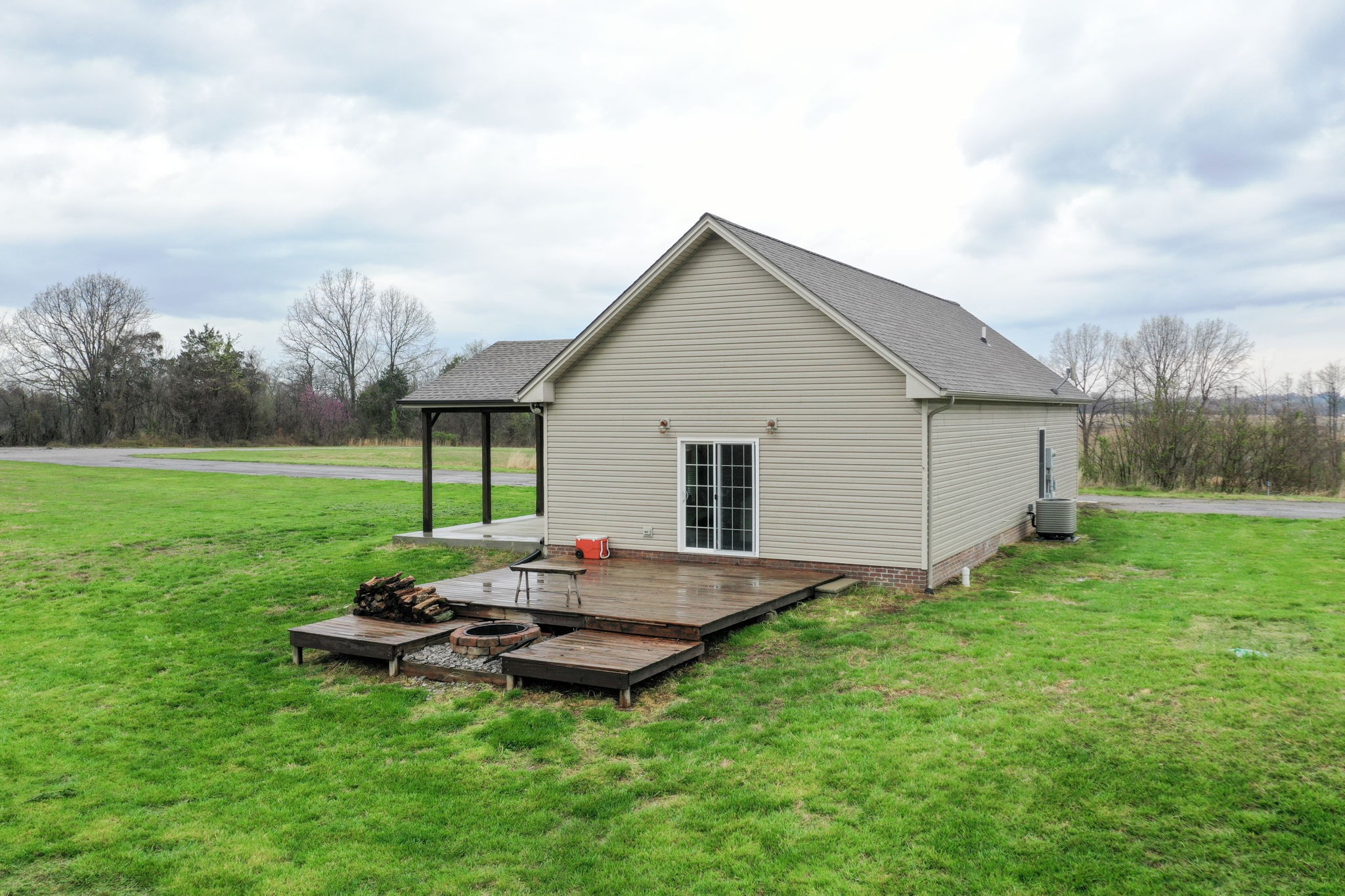 5273 Zander Road Hopkinsville, KY 42240 - Photo 49 of 75 a backyard of a house with table and chairs