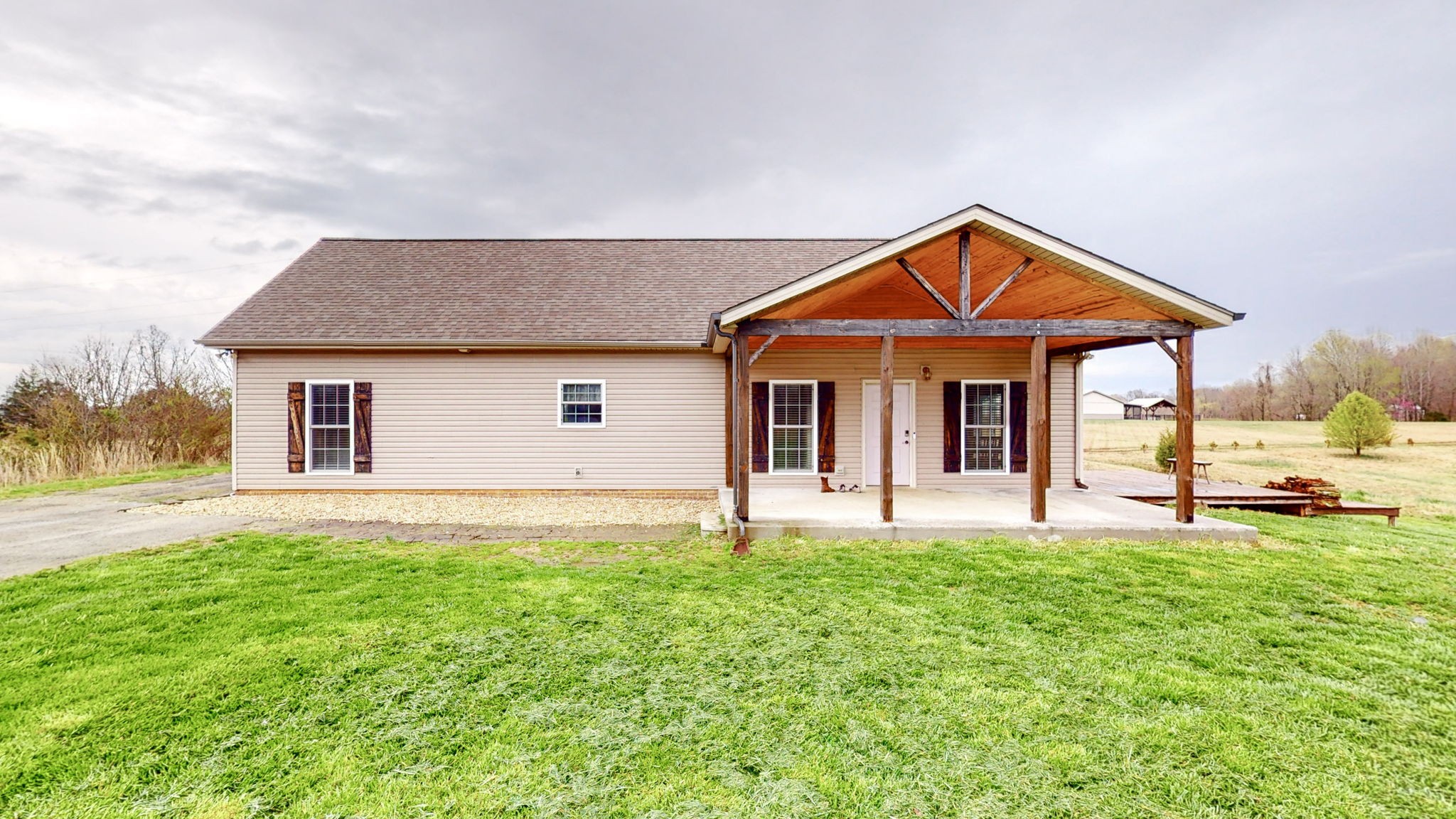 5273 Zander Road Hopkinsville, KY 42240 - Photo 5 of 75 a front view of a house with a yard and garage