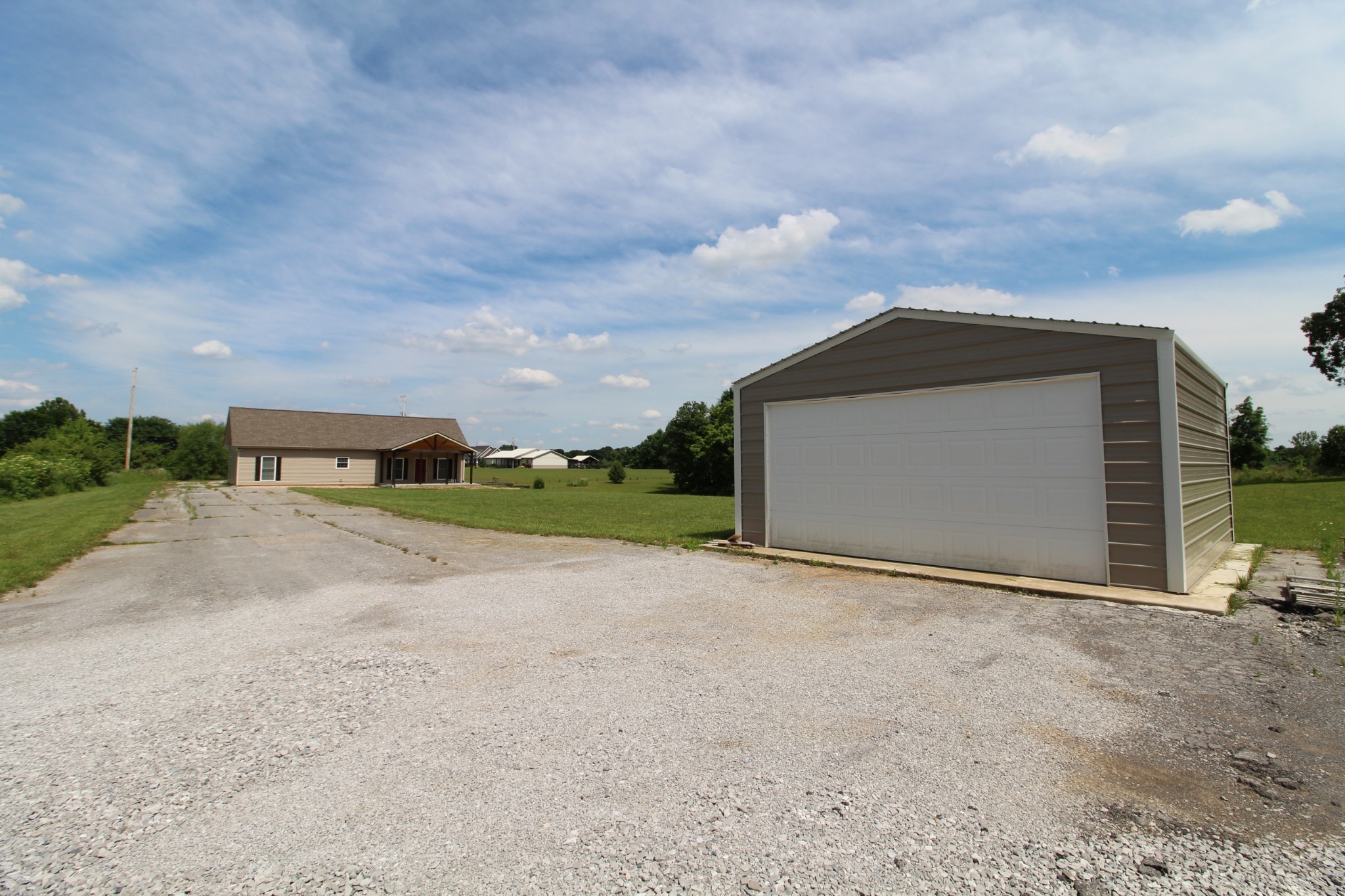 5273 Zander Road Hopkinsville, KY 42240 - Photo 51 of 75 a view of an house with backyard and bushes