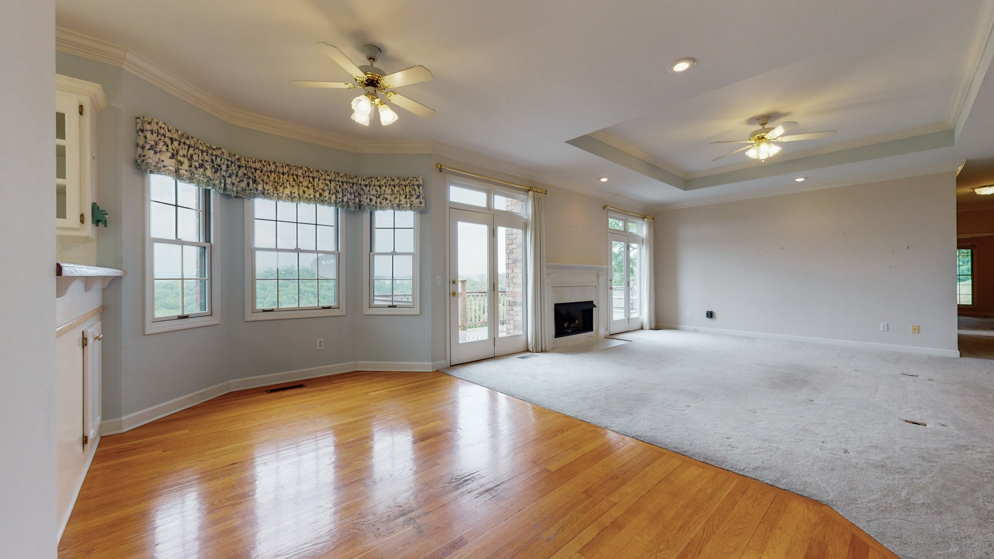 899 Normandy Road Normandy, TN 37360 - Photo 22 of 47 a view of an empty room with window and wooden floor