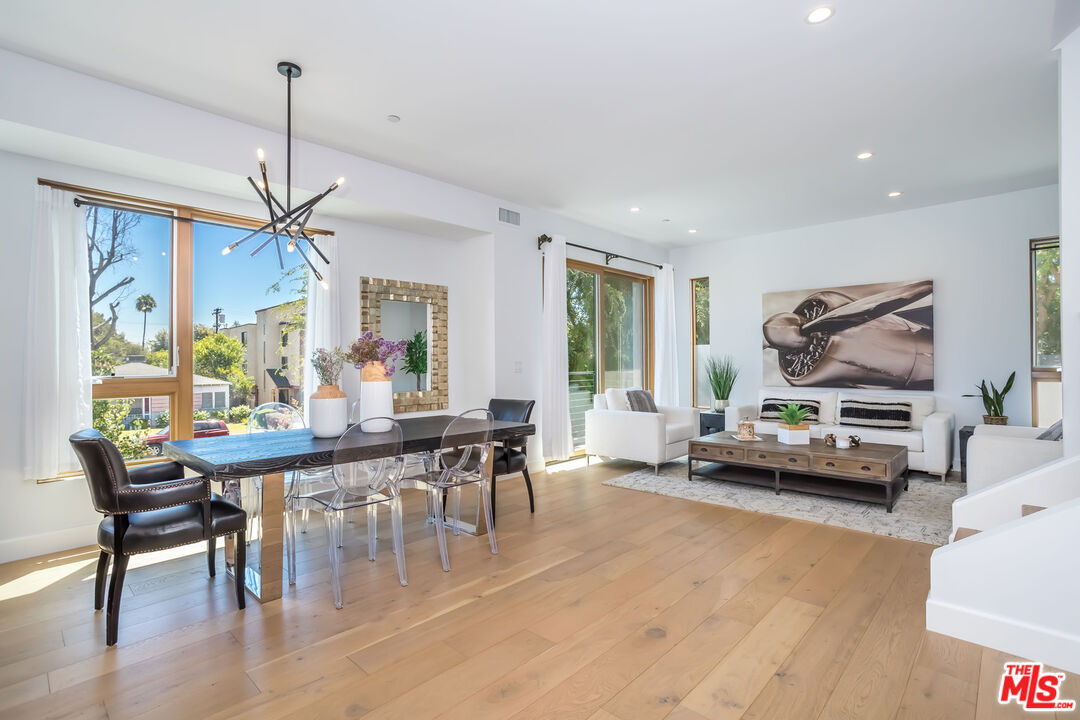 4531 Tujunga Avenue Studio City, CA 91602 - Photo 13 of 49 a living room with furniture a window and gym equipment
