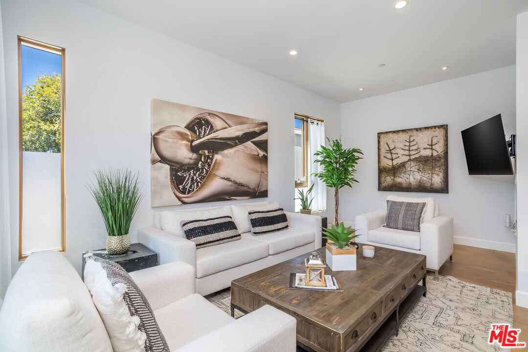 4531 Tujunga Avenue Studio City, CA 91602 - Photo 15 of 49 a living room with furniture potted plant and a window