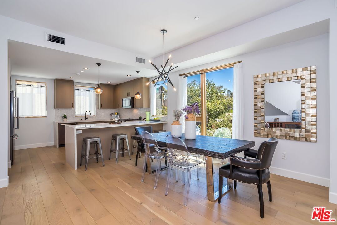 4531 Tujunga Avenue Studio City, CA 91602 - Photo 19 of 49 a dining room with furniture window wooden floor