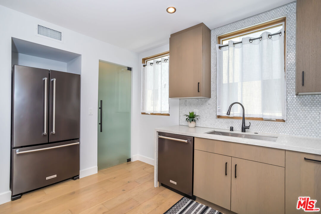 4531 Tujunga Avenue Studio City, CA 91602 - Photo 24 of 49 a kitchen with a sink and stainless steel appliances