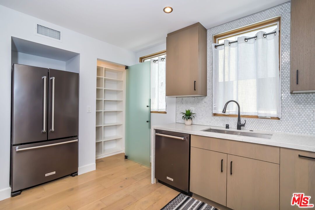 4531 Tujunga Avenue Studio City, CA 91602 - Photo 25 of 49 a view of a kitchen sink and a refrigerator