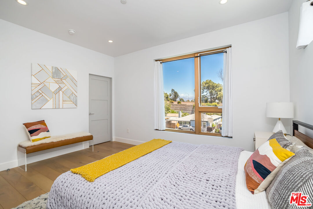4531 Tujunga Avenue Studio City, CA 91602 - Photo 30 of 49 a bedroom with furniture and a window