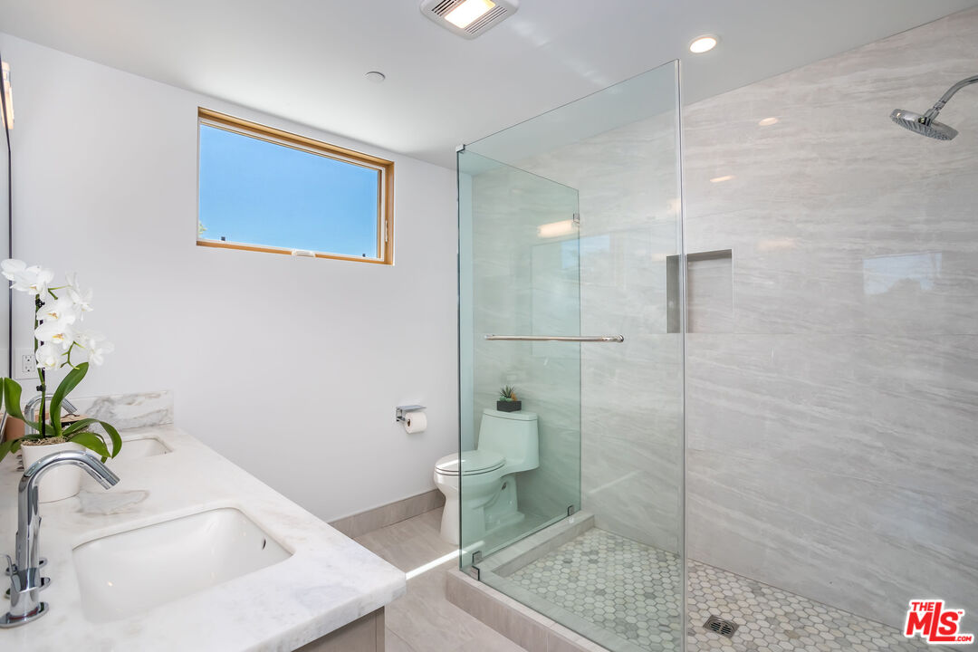 4531 Tujunga Avenue Studio City, CA 91602 - Photo 32 of 49 a bathroom with a sink a toilet and shower