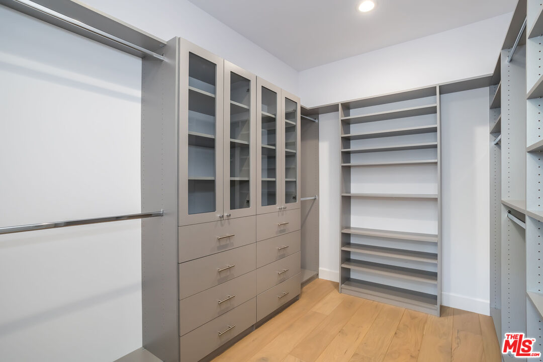 4531 Tujunga Avenue Studio City, CA 91602 - Photo 33 of 49 a view of walk in closet with empty racks