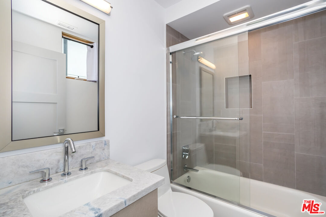 4531 Tujunga Avenue Studio City, CA 91602 - Photo 38 of 49 a bathroom with a granite countertop sink toilet and shower