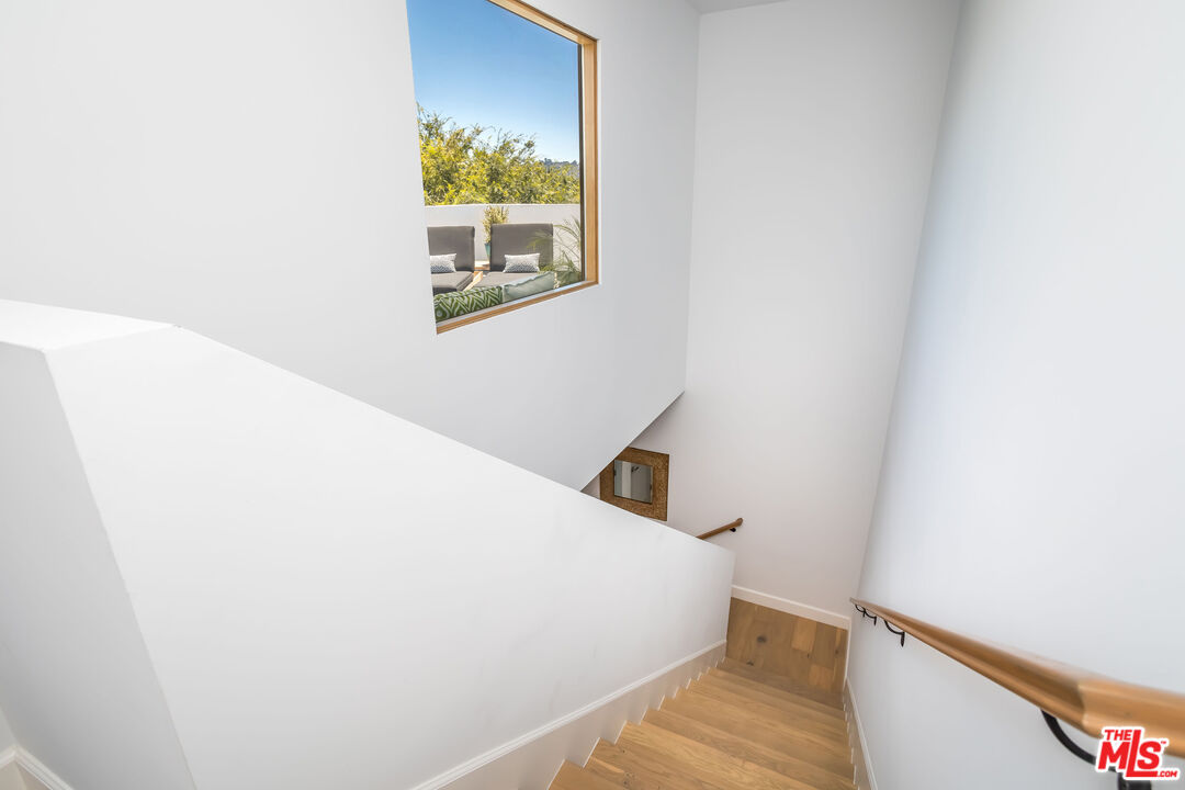 4531 Tujunga Avenue Studio City, CA 91602 - Photo 40 of 49 a view of a bedroom with wooden floor and a window