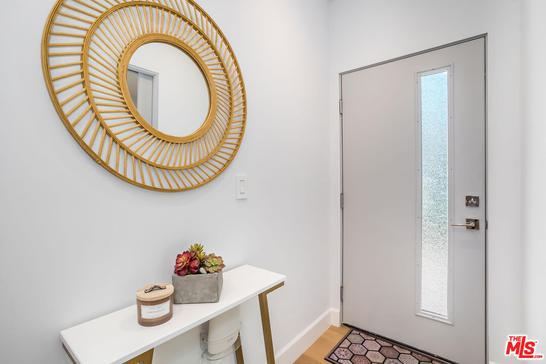 4531 Tujunga Avenue Studio City, CA 91602 - Photo 8 of 49 a bathroom with a sink mirror and a window