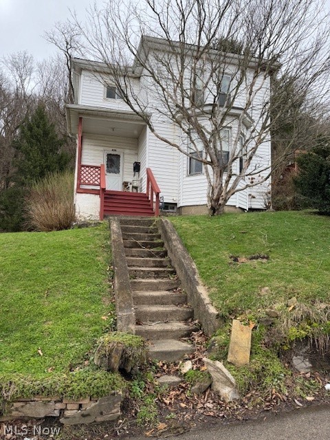 626 High Street Wellsburg, WV 26070 - Photo 1 of 18 View of front of house featuring a front lawn and a porch