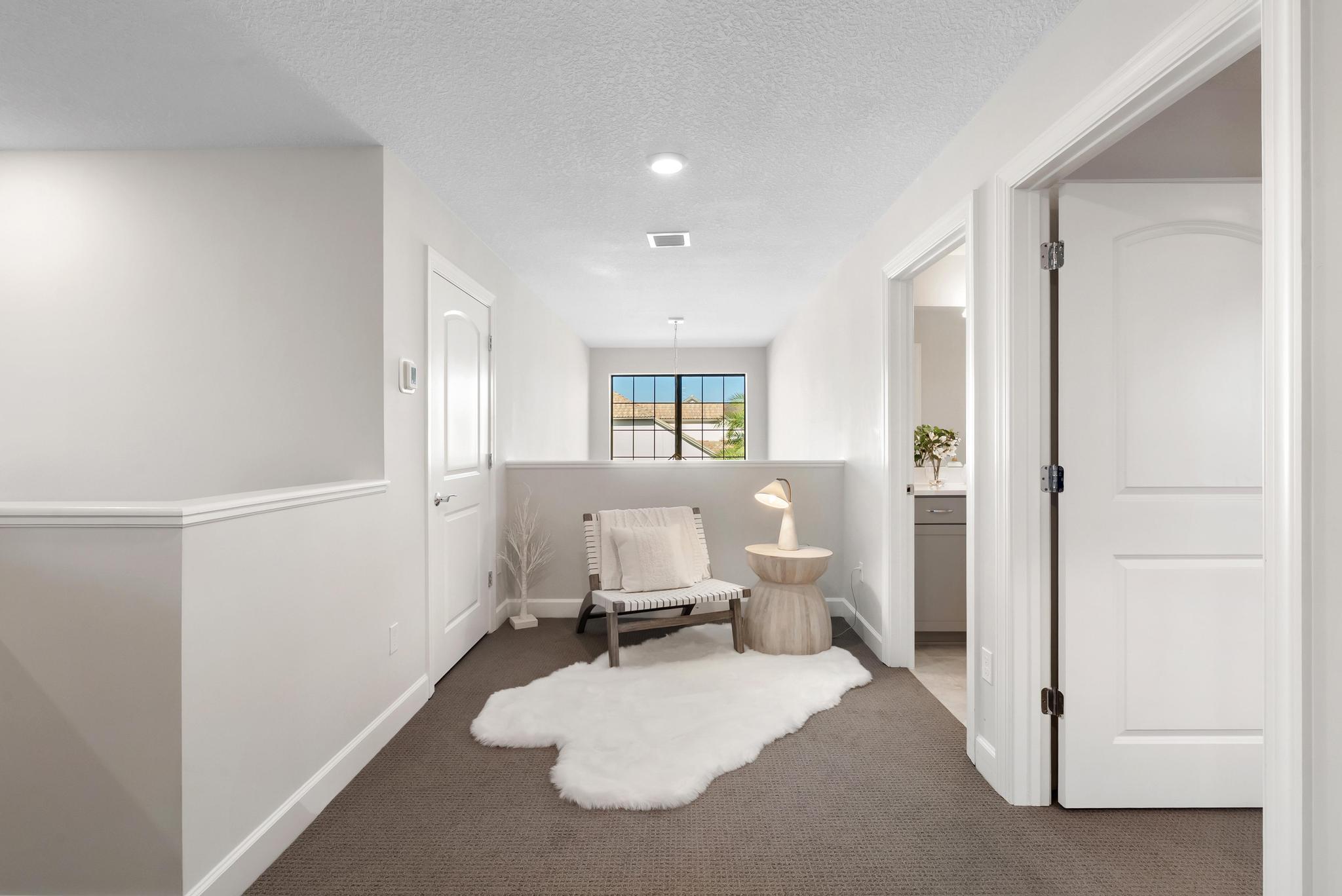 137 Cinder Dunes Point Jupiter, FL 33478 - Photo 24 of 45 a bedroom with a bed and wooden floor