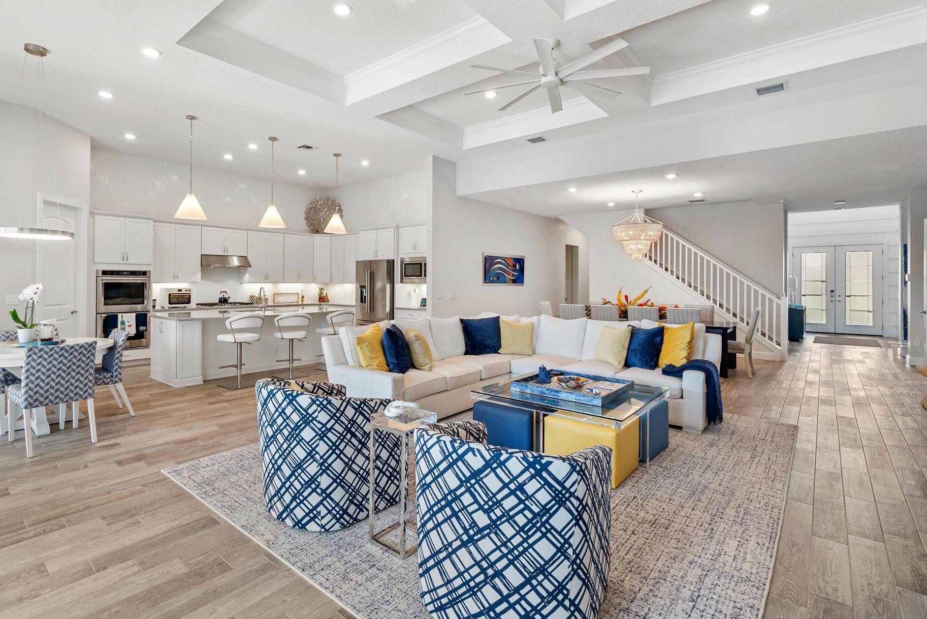 137 Cinder Dunes Point Jupiter, FL 33478 - Photo 3 of 45 a living room with lots of furniture and kitchen view