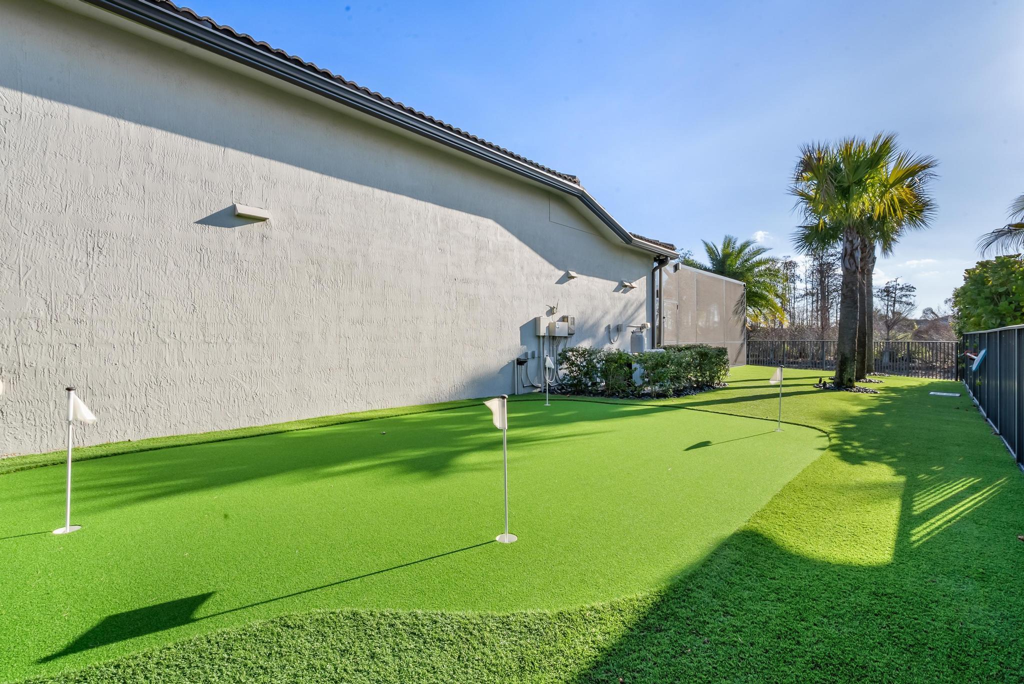 137 Cinder Dunes Point Jupiter, FL 33478 - Photo 31 of 45 a view of a golf course with a garden
