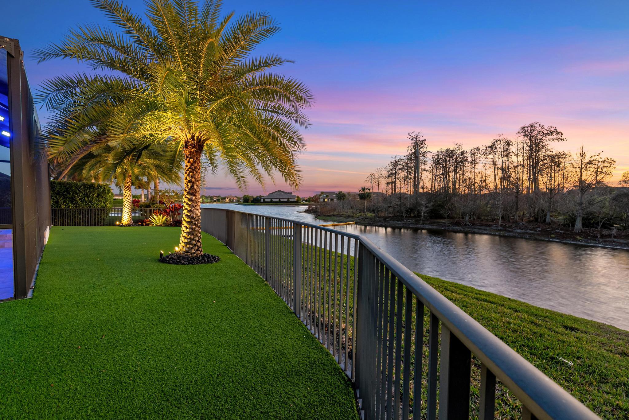 137 Cinder Dunes Point Jupiter, FL 33478 - Photo 32 of 45 a view of a lake with a garden