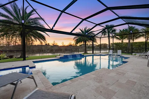a view of swimming pool with a patio and a backyard