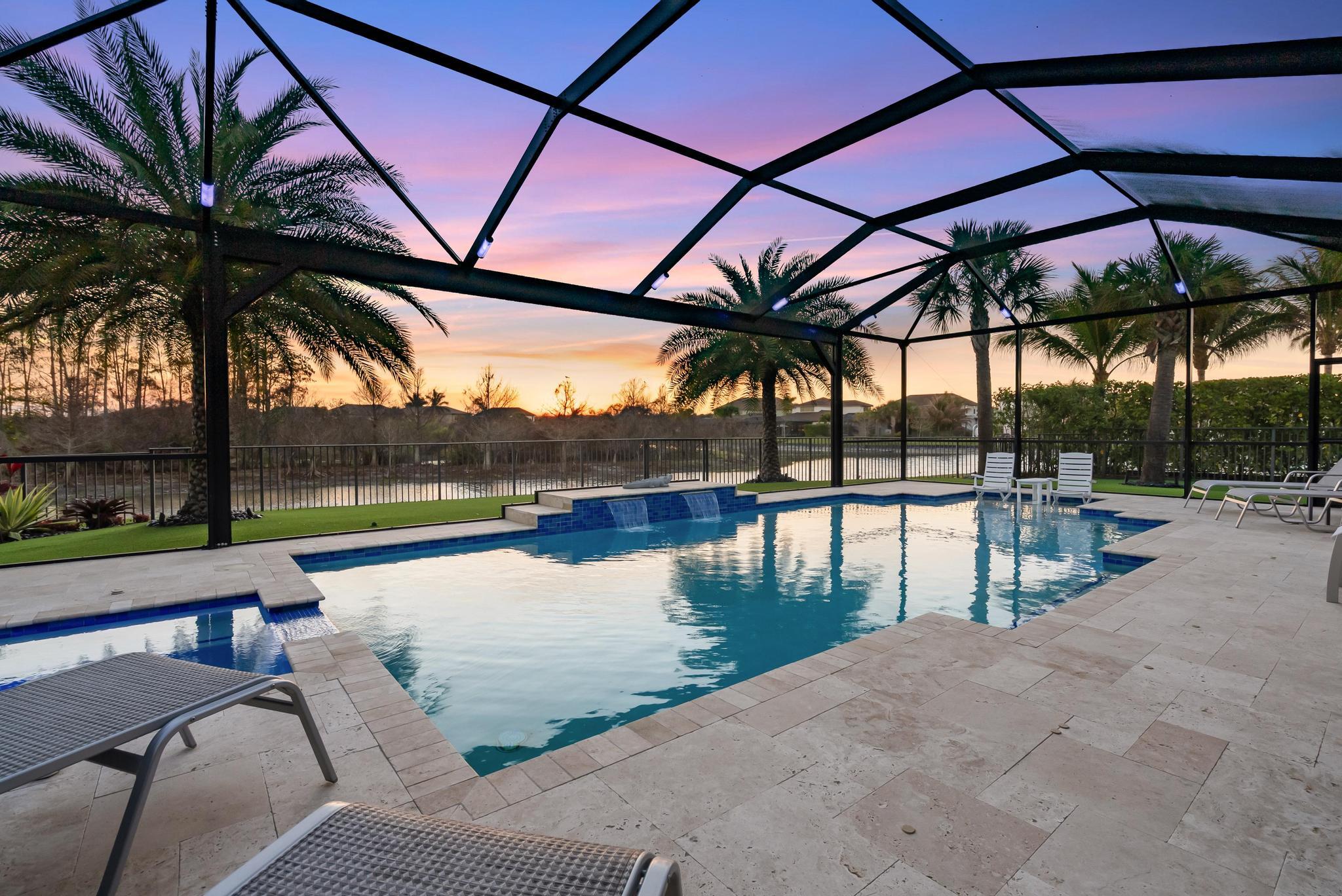137 Cinder Dunes Point Jupiter, FL 33478 - Photo 34 of 45 a view of swimming pool with a patio and a backyard