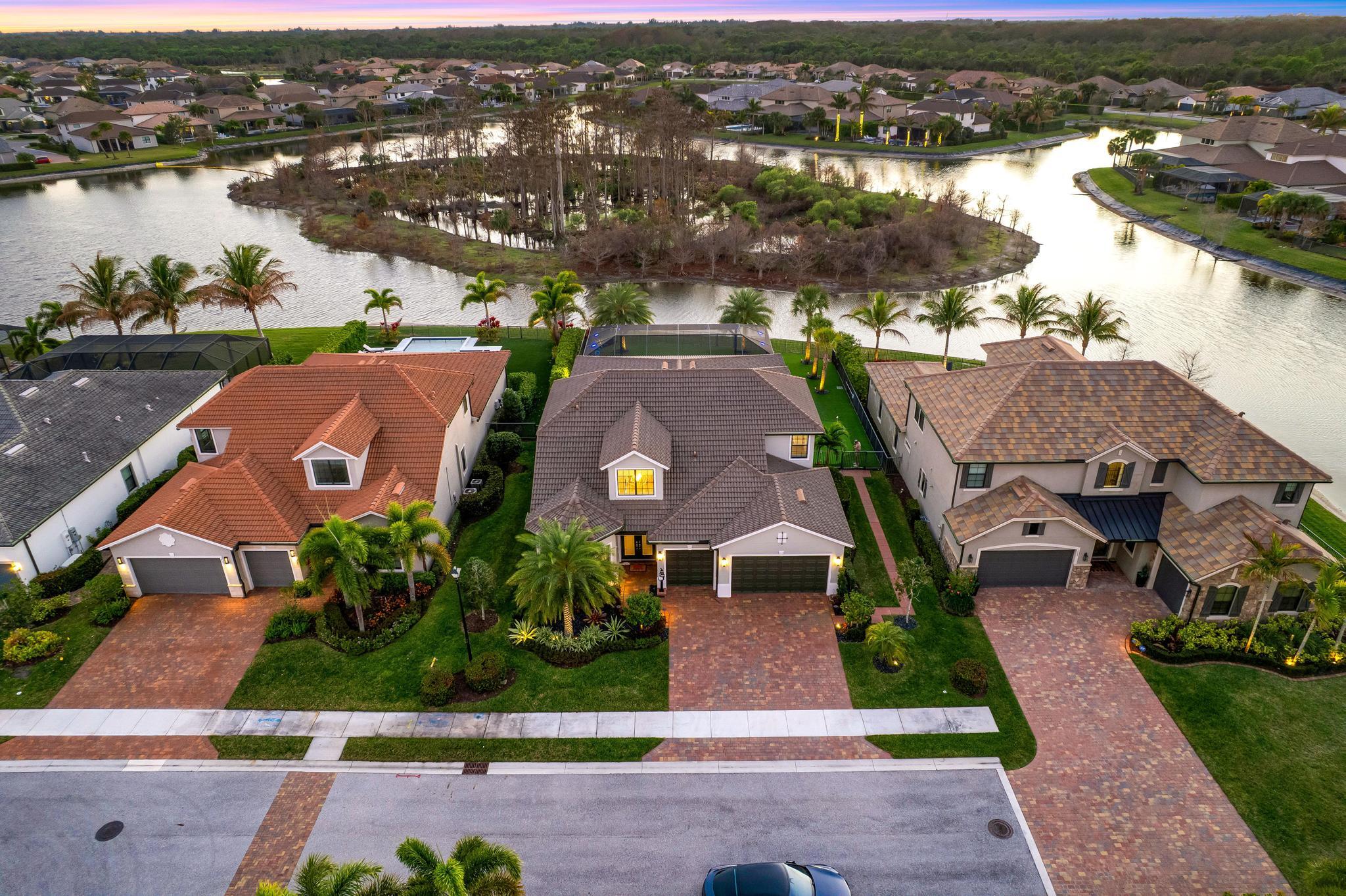 137 Cinder Dunes Point Jupiter, FL 33478 - Photo 37 of 45 an aerial view of a house with a lake view