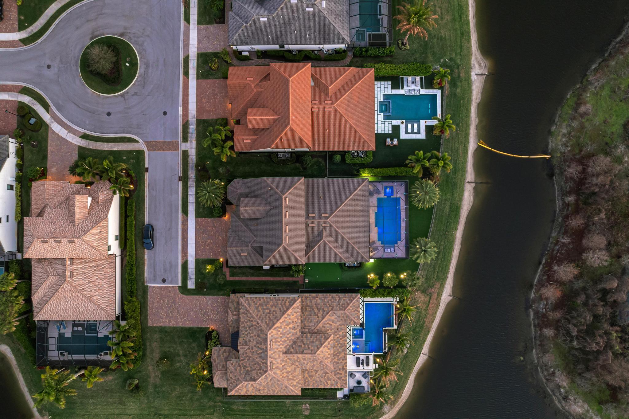 137 Cinder Dunes Point Jupiter, FL 33478 - Photo 40 of 45 an aerial view of a house with a yard and a large tree
