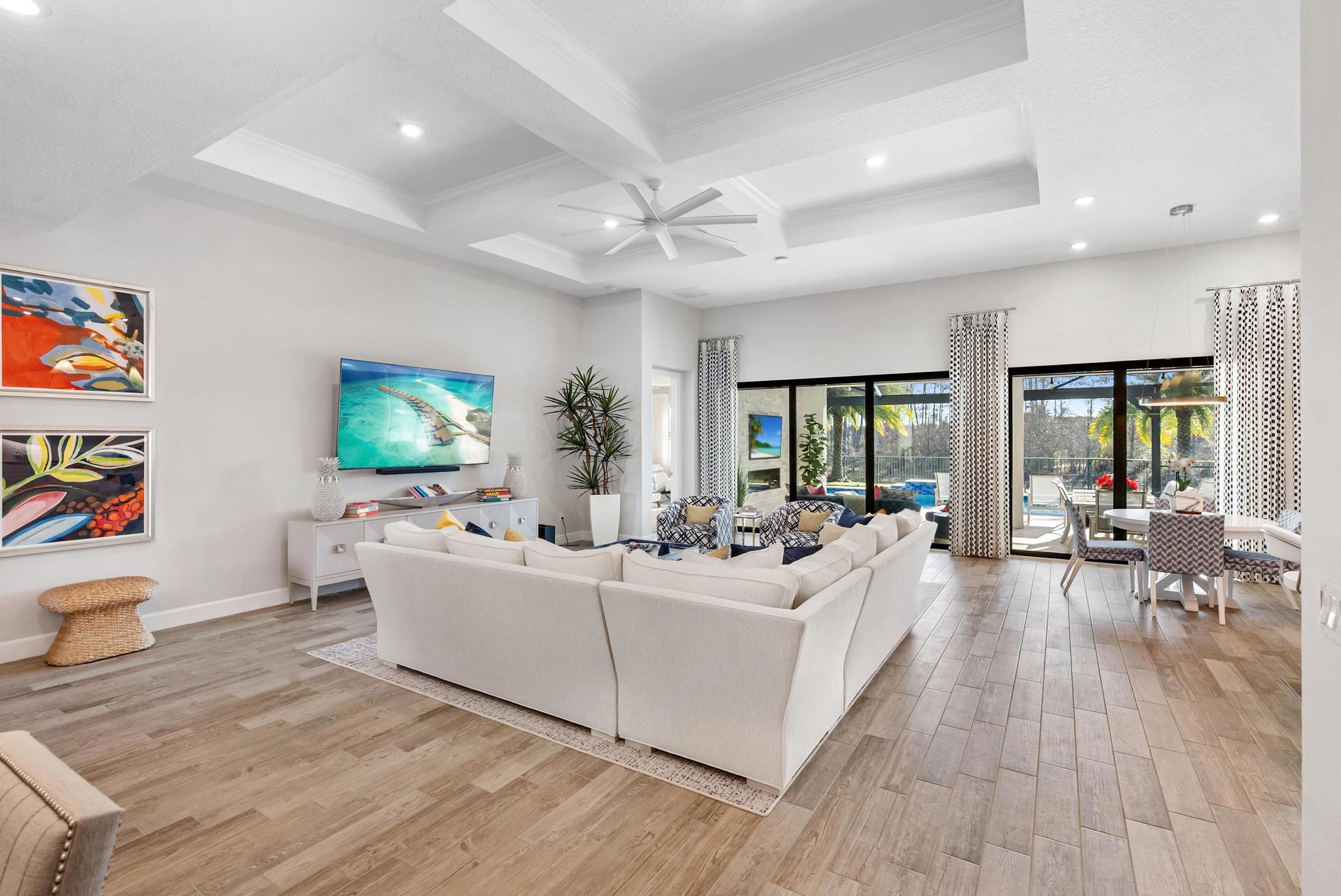 137 Cinder Dunes Point Jupiter, FL 33478 - Photo 4 of 45 a living room with furniture and a flat screen tv